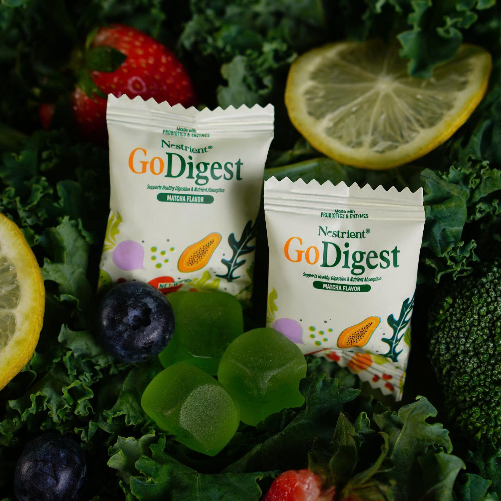 Nestrient GoDigest probiotic and enzyme gummies in matcha flavor, showing green matcha-flavored chewable supplements with vibrant packaging